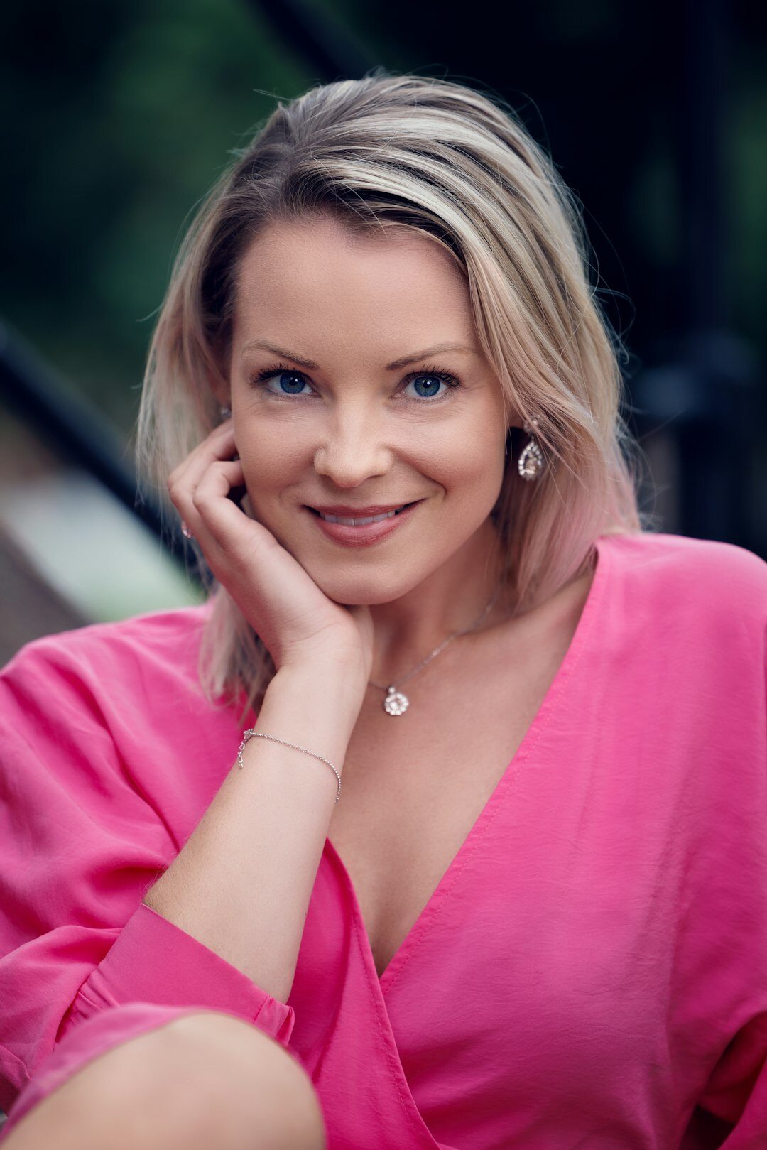 European female television presenter in a colourful retro TV studio