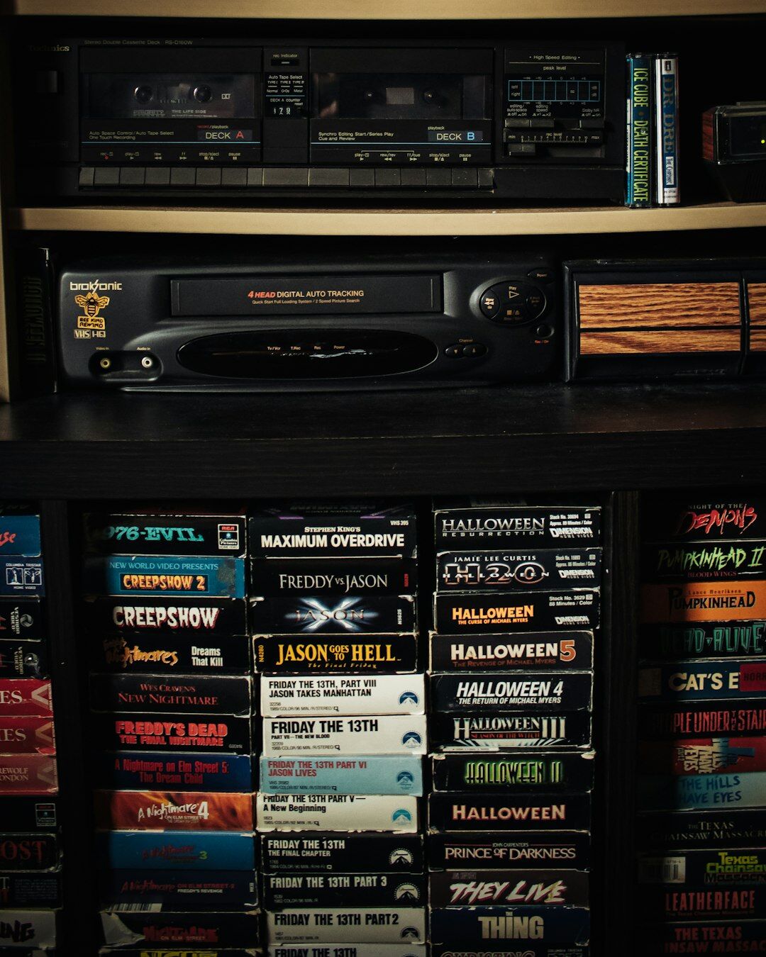 Shelves filled with archived vintage videotapes and film reels in a television archive